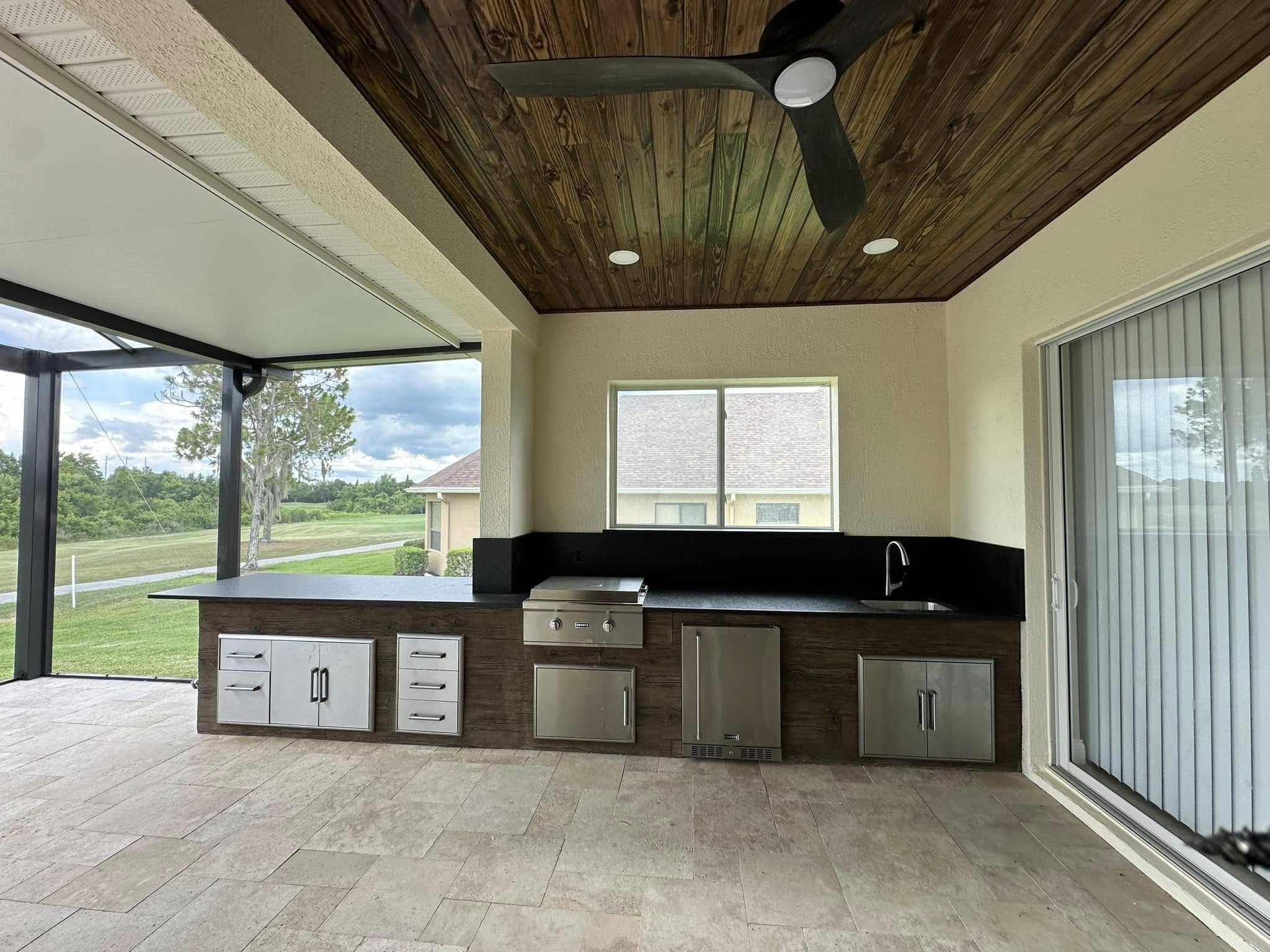 Custom River Boulder Outdoor Kitchen with Granite Tops and Coyote Appliances – Lakeland, FL